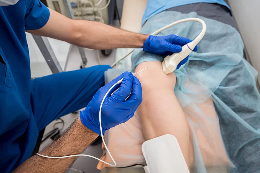 doctor performing ablation for varicose veins