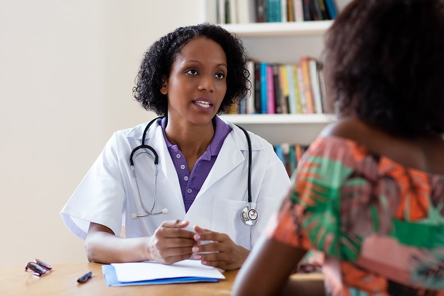 radiologist talking with patient about ufe