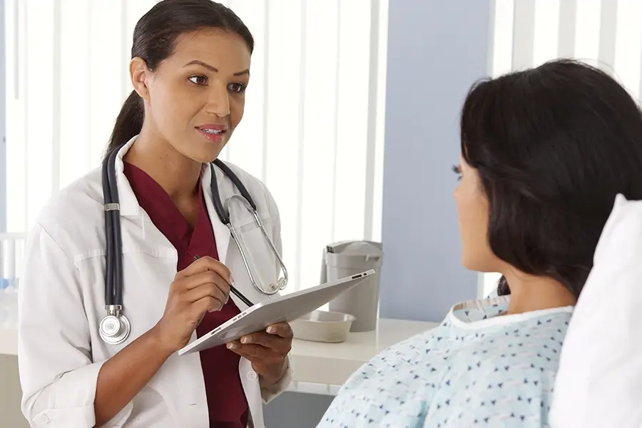 fibroid doctor talking with a patient about UFE